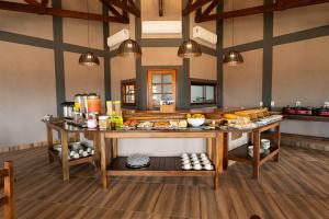 a room with a table with food on it at Tekoha Eco Hotel in Bonito
