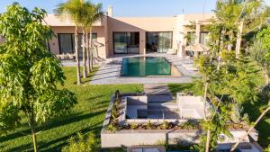 an aerial view of a house with a swimming pool at Berber Garden in Aït Amara