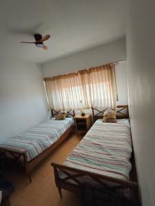 Ένα ή περισσότερα κρεβάτια σε δωμάτιο στο En el mar