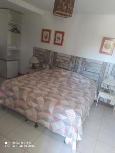 Giường trong phòng chung tại Recanto Arembepe