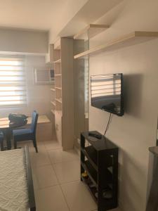 TV a/nebo společenská místnost v ubytování Citadines II