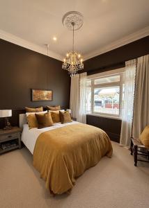 En eller flere senge i et værelse på Seapoint Cottage, Luxury Accommodation