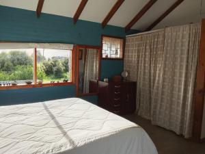 En eller flere senge i et værelse på Casa en parcela