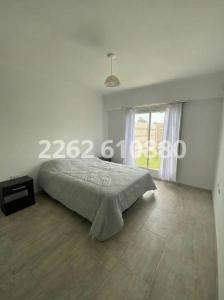 En eller flere senge i et værelse på Casa en zona parque dos cuartos