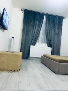 TV a/nebo společenská místnost v ubytování BellaHome Residence