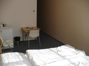 Postel nebo postele na pokoji v ubytování Pension Milk Inn