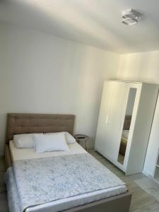 Postel nebo postele na pokoji v ubytování BellaHome Residence