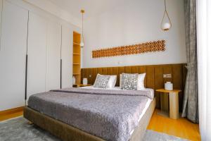 Ένα ή περισσότερα κρεβάτια σε δωμάτιο στο Résidence LOBOS