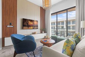 a living room with a couch and a chair at NOK Elegant 2BR Apt by Vistacana in Punta Cana