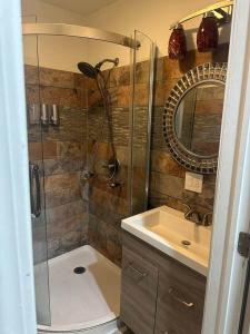 a bathroom with a shower and a sink at The Marlowe, A Couples Getaway in Chicago +39 photos