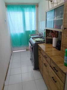 Kuchyň nebo kuchyňský kout v ubytování Comoda casa independiente