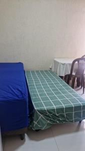 Una cama o camas en una habitación de KIT 01 TERREO 5 PESSOAS LEo 1 fotos más