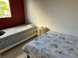 En eller flere senge i et værelse på Village - Linha Verde C02 + 46 billeder