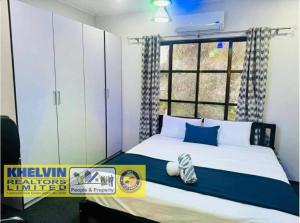 En eller flere senge i et værelse på Villa Up Your Holiday