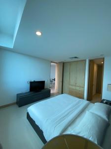 En eller flere senge i et værelse på Blue Gardens + 2 billeder