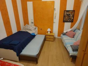 Postel nebo postele na pokoji v ubytování Camera in pieno centro storico