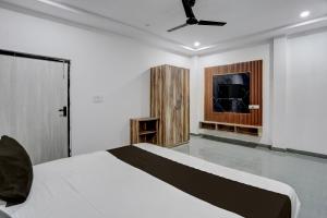 Postel nebo postele na pokoji v ubytování Hotel O THE AMBROSIA STAY