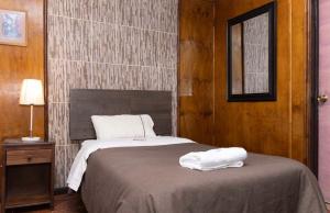 Una cama o camas en una habitación de Hotel de la Costa 5 fotos más