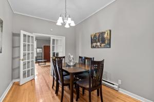 a dining room with a table and chairs at Cozy 2BR Loft Parking Wi-Fi in St. John's