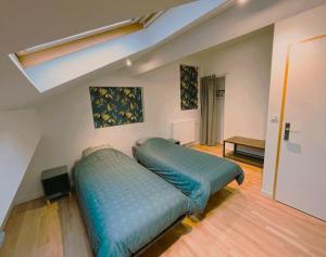 Postel nebo postele na pokoji v ubytování T4 en duplex, résidence atypique en pleine forêt