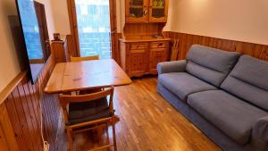 Et opholdsområde på Coccola Zoldana - Lovely apartment 2BR