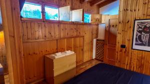 En eller flere senge i et værelse på Coccola Zoldana - Lovely apartment 2BR