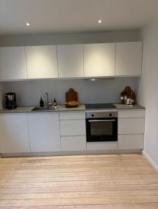 Kuchyň nebo kuchyňský kout v ubytování Unique Living - Herning City Central House