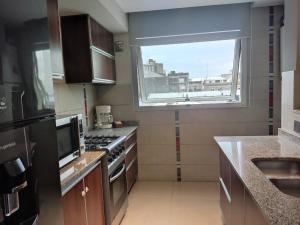 Kuchyň nebo kuchyňský kout v ubytování Comfort and Location + 9 fotografií