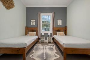 Postel nebo postele na pokoji v ubytování Hunter Valley Spa Stay