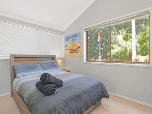 En eller flere senge i et værelse på Sunset Mooring at Soldiers Point + 26 billeder