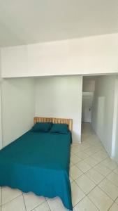 En eller flere senge i et værelse på Studio Carioca