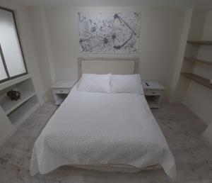 En eller flere senge i et værelse på Apartamento Manizales excelente ubicación