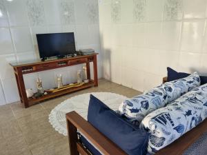 TV a/nebo společenská místnost v ubytování Espaço Verde Hospedagem