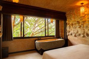 Postel nebo postele na pokoji v ubytování Mayan Monkey Isla Mujeres - Social Hotel + 19 fotografií