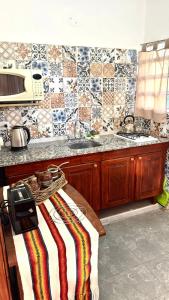 Η κουζίνα ή μικρή κουζίνα στο cabaña EL CHALECITO DE ANA +8 φωτογραφίες