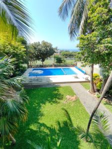 an image of a swimming pool in a yard at Casa Los Mangales in Brisas de Zicatela