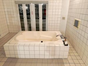 Koupelna v ubytování 伊香保の星空 + 38 fotografií