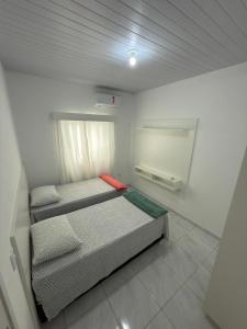 En eller flere senge i et værelse på Casa em Barreirinhas