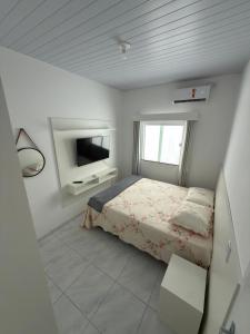 En eller flere senge i et værelse på Casa em Barreirinhas + 4 billeder