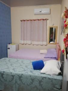 Postel nebo postele na pokoji v ubytování Pousada Flores