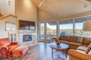 a living room with a couch and a fireplace at River Ridge 421A - Meredith Lodging in Bend