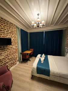 En eller flere senge i et værelse på Veva Flats