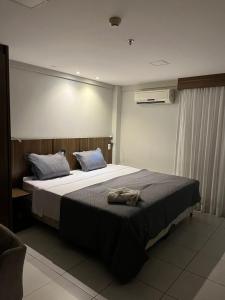 Postel nebo postele na pokoji v ubytování Flat Studio - Conforto do 6 Andar