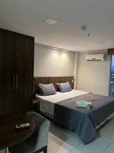 Ένα ή περισσότερα κρεβάτια σε δωμάτιο στο Flat Studio - Conforto do 6 Andar