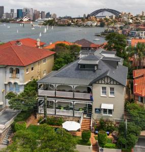 an aerial view of a large house in a city at Cremorne Point Manor in Sydney