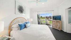 Ένα ή περισσότερα κρεβάτια σε δωμάτιο στο Hibbard Waterfront Escape +10 φωτογραφίες