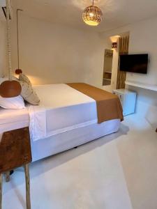 Ένα ή περισσότερα κρεβάτια σε δωμάτιο στο Pousada Tamuré +3 φωτογραφίες