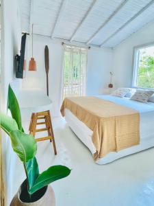 Ένα ή περισσότερα κρεβάτια σε δωμάτιο στο Pousada Tamuré