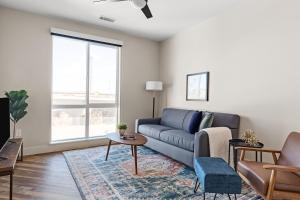 a living room with a couch and a table at Kasa Rino Denver in Denver