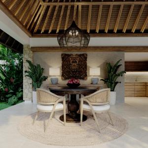 a dining room with a table and two chairs at The One Boutique Villa in Seminyak